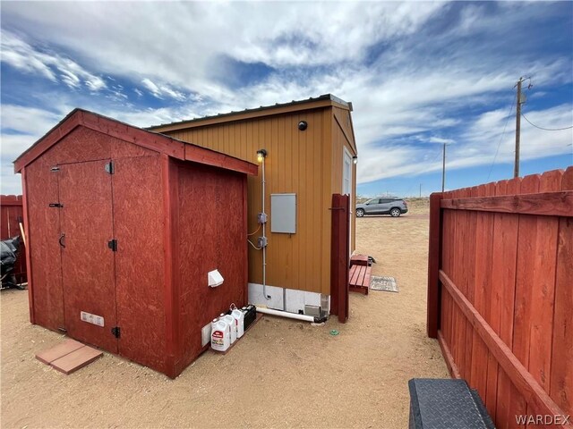 view of shed with fence