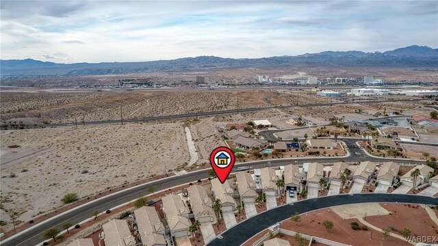 birds eye view of property featuring a residential view and a mountain view