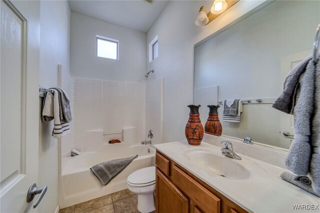 bathroom with shower / bathing tub combination, vanity, toilet, and tile patterned floors