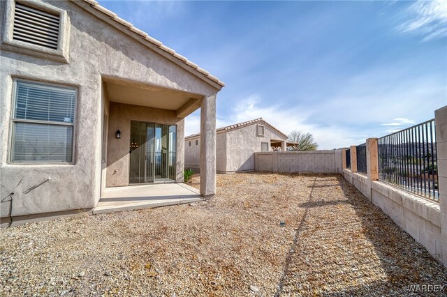 view of yard featuring a fenced backyard and a patio