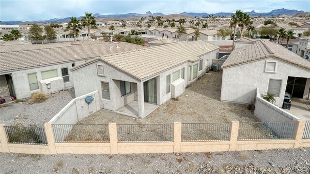 birds eye view of property with a mountain view and a residential view