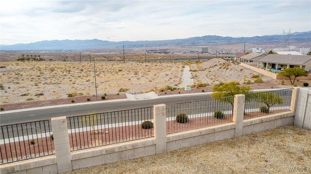 view of yard featuring fence private yard and a mountain view