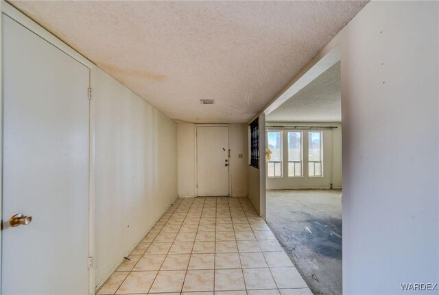 interior space with a textured ceiling