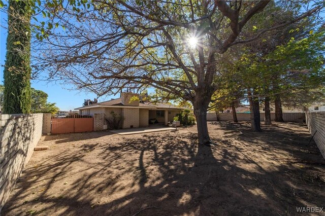 view of yard with a patio and fence