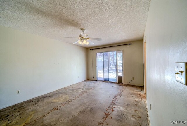 empty room with a textured ceiling, a ceiling fan, and unfinished concrete floors