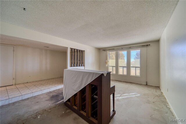 interior space with a textured ceiling