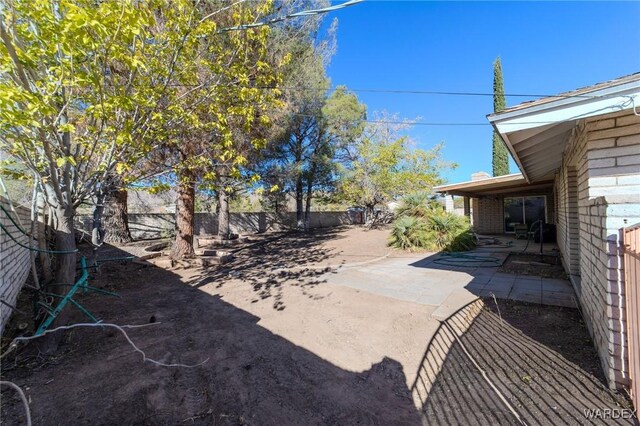 view of yard featuring a patio area and a fenced backyard