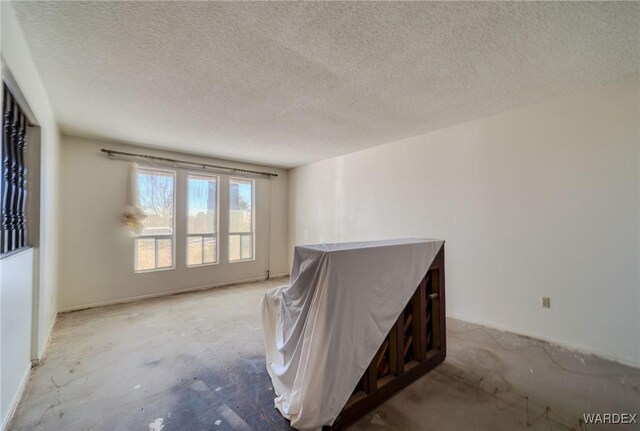 empty room with a textured ceiling