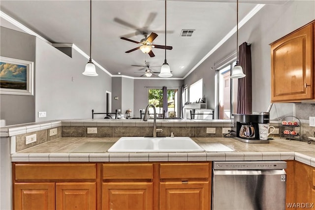 kitchen featuring crown molding, visible vents, brown cabinetry, a sink, and dishwasher