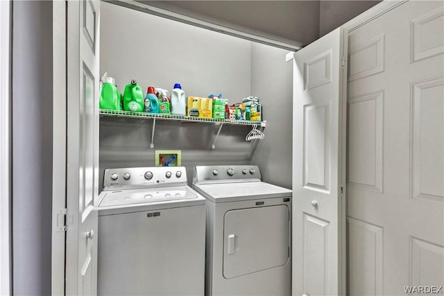 washroom featuring laundry area and separate washer and dryer