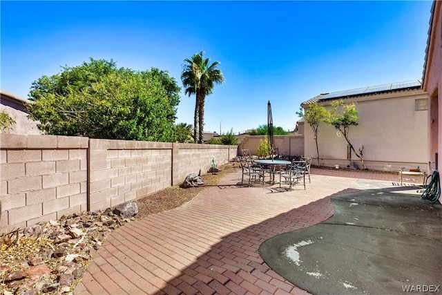 view of patio / terrace with outdoor dining space and a fenced backyard