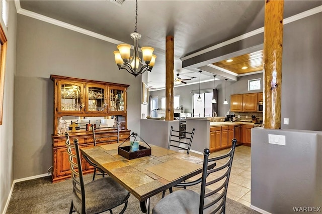 dining area featuring beam ceiling, crown molding, light tile patterned floors, a chandelier, and baseboards