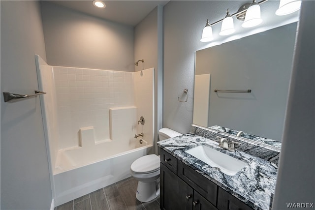 full bath featuring tub / shower combination, vanity, toilet, and wood tiled floor