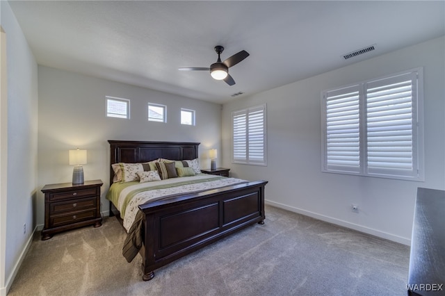 bedroom featuring ceiling fan, carpet floors, visible vents, and baseboards