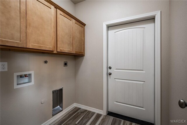 laundry room featuring hookup for a washing machine, hookup for a gas dryer, dark wood-style flooring, cabinet space, and electric dryer hookup