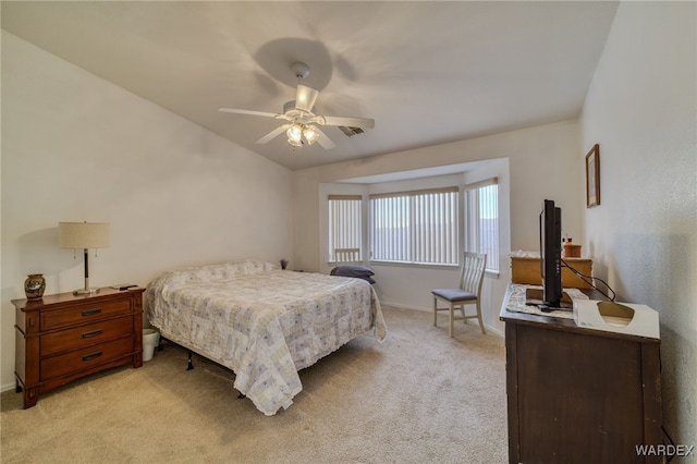 bedroom featuring a ceiling fan, light carpet, and baseboards