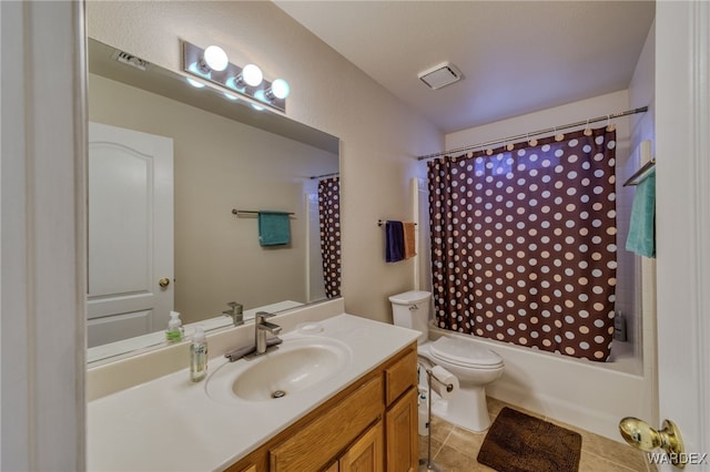 bathroom featuring shower / tub combo, vanity, toilet, and tile patterned floors