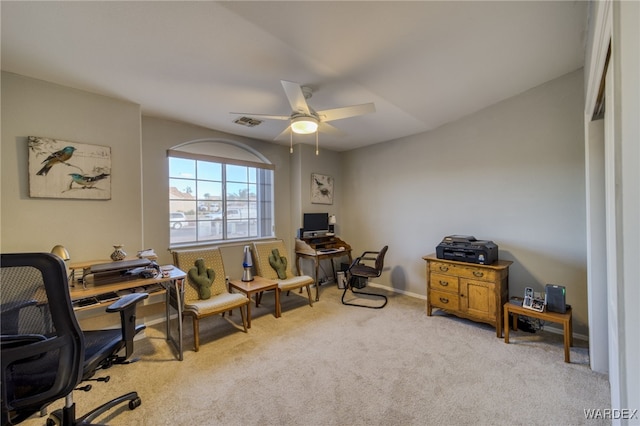 carpeted office with a ceiling fan, visible vents, and baseboards