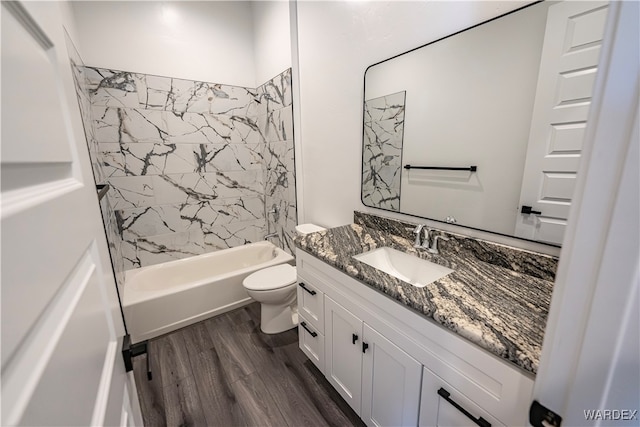 full bathroom featuring shower / bath combination, vanity, toilet, and wood finished floors