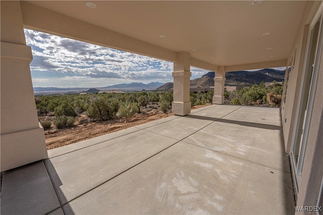 view of patio / terrace with a mountain view