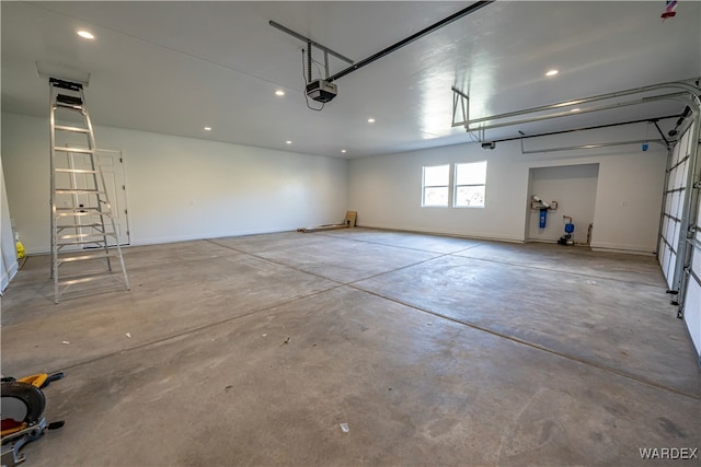 garage featuring baseboards and a garage door opener