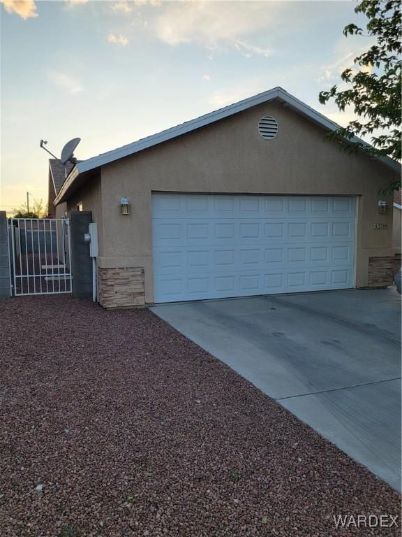 garage with concrete driveway