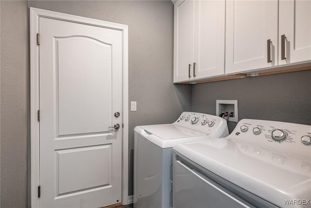 laundry room featuring cabinet space and independent washer and dryer