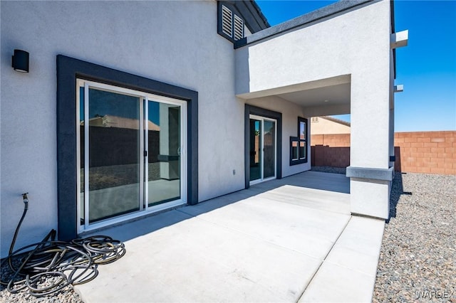 view of patio featuring fence