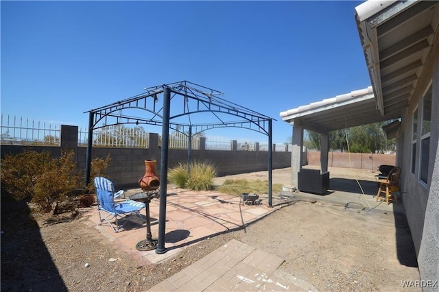 view of patio / terrace with a gazebo and a fenced backyard