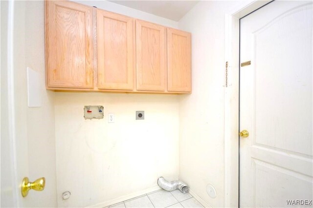 laundry area with hookup for a washing machine, hookup for a gas dryer, cabinet space, light tile patterned flooring, and electric dryer hookup