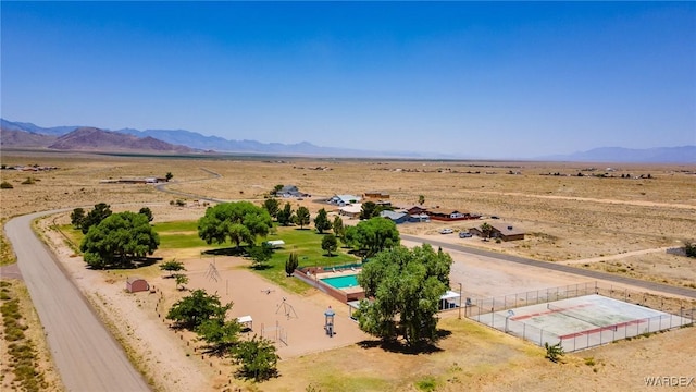 birds eye view of property with a mountain view