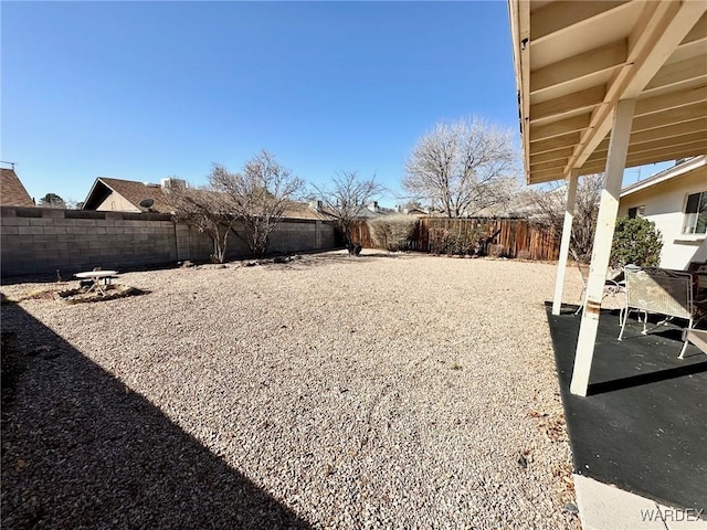 view of yard with a patio area and a fenced backyard