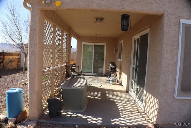 view of patio featuring fence