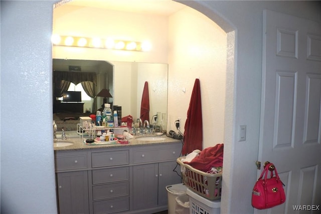 bathroom featuring double vanity and a sink