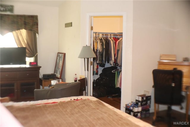 bedroom with a closet and a walk in closet