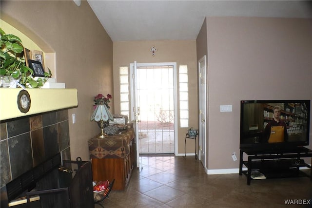 entrance foyer with tile patterned flooring and baseboards