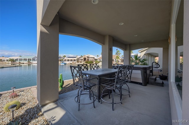 view of patio / terrace with a water view