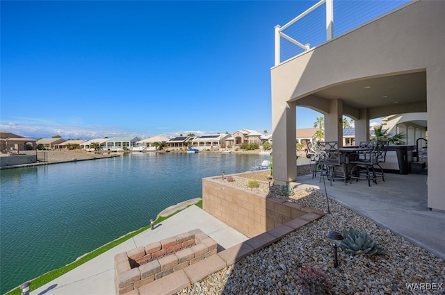 exterior space with a water view and a residential view