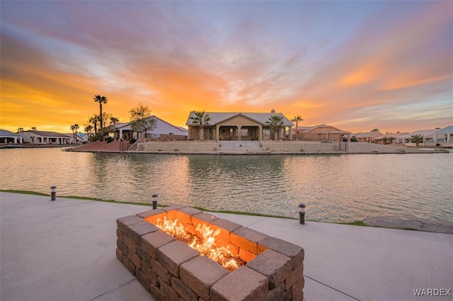 property view of water featuring a residential view and a fire pit