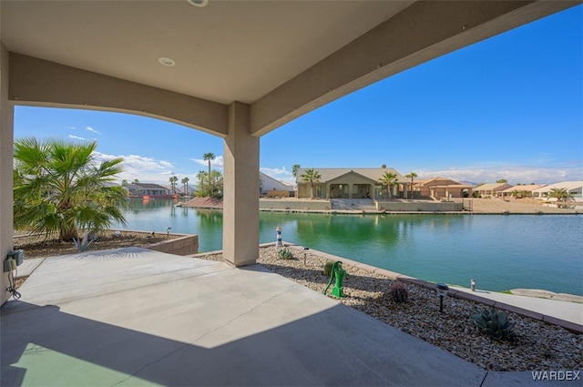 view of patio / terrace featuring a water view and a residential view