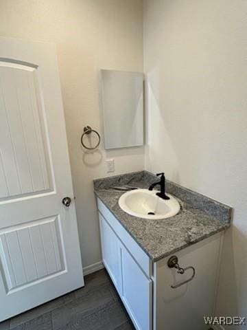 bathroom with vanity and wood finished floors