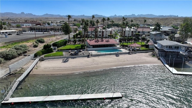 drone / aerial view with a residential view and a water and mountain view