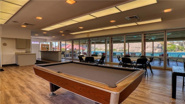 recreation room featuring light wood-type flooring and visible vents