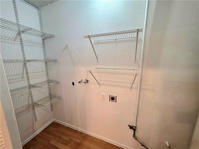 3166 E Thompson Ave, Kingman, AZ 86409 - laundry room featuring dark wood-type flooring, hookup for a washing machine, hookup for an electric dryer, and baseboards