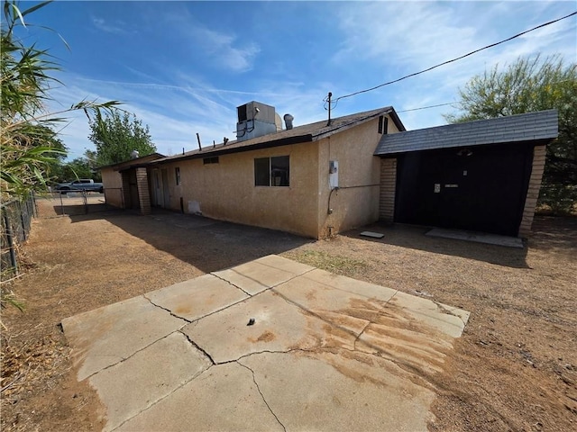 3166 E Thompson Ave, Kingman, AZ 86409 - rear view of house with stucco siding and a patio