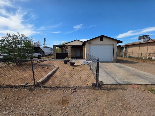 3166 E Thompson Ave, Kingman, AZ 86409 - ranch-style home with driveway, a garage, a fenced front yard, and stucco siding