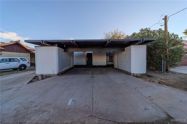 view of front of property with a carport and driveway