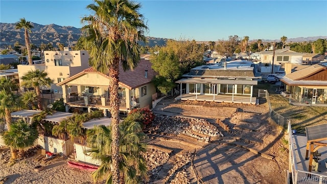 exterior space with a residential view and a mountain view