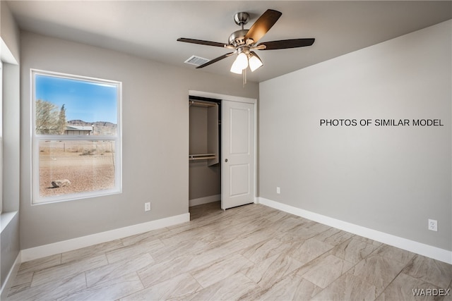 unfurnished bedroom featuring a closet, visible vents, and baseboards