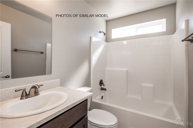 full bathroom featuring shower / bathing tub combination, vanity, and toilet